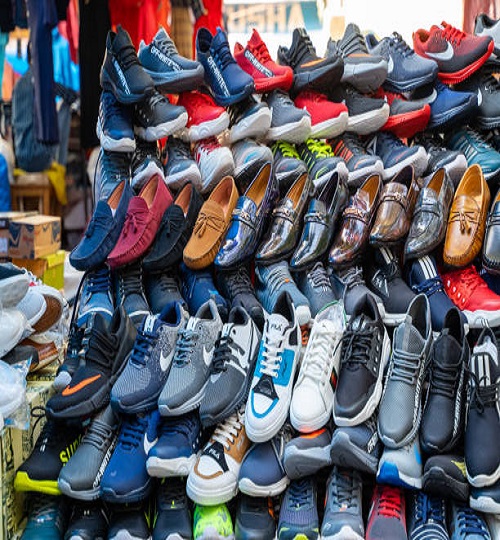 New Delhi, India - November 17, 2019: Mens knock off designer shoes for sale in Nehru Place. This market is filled with electronic goods, cell phone accessories and clothing